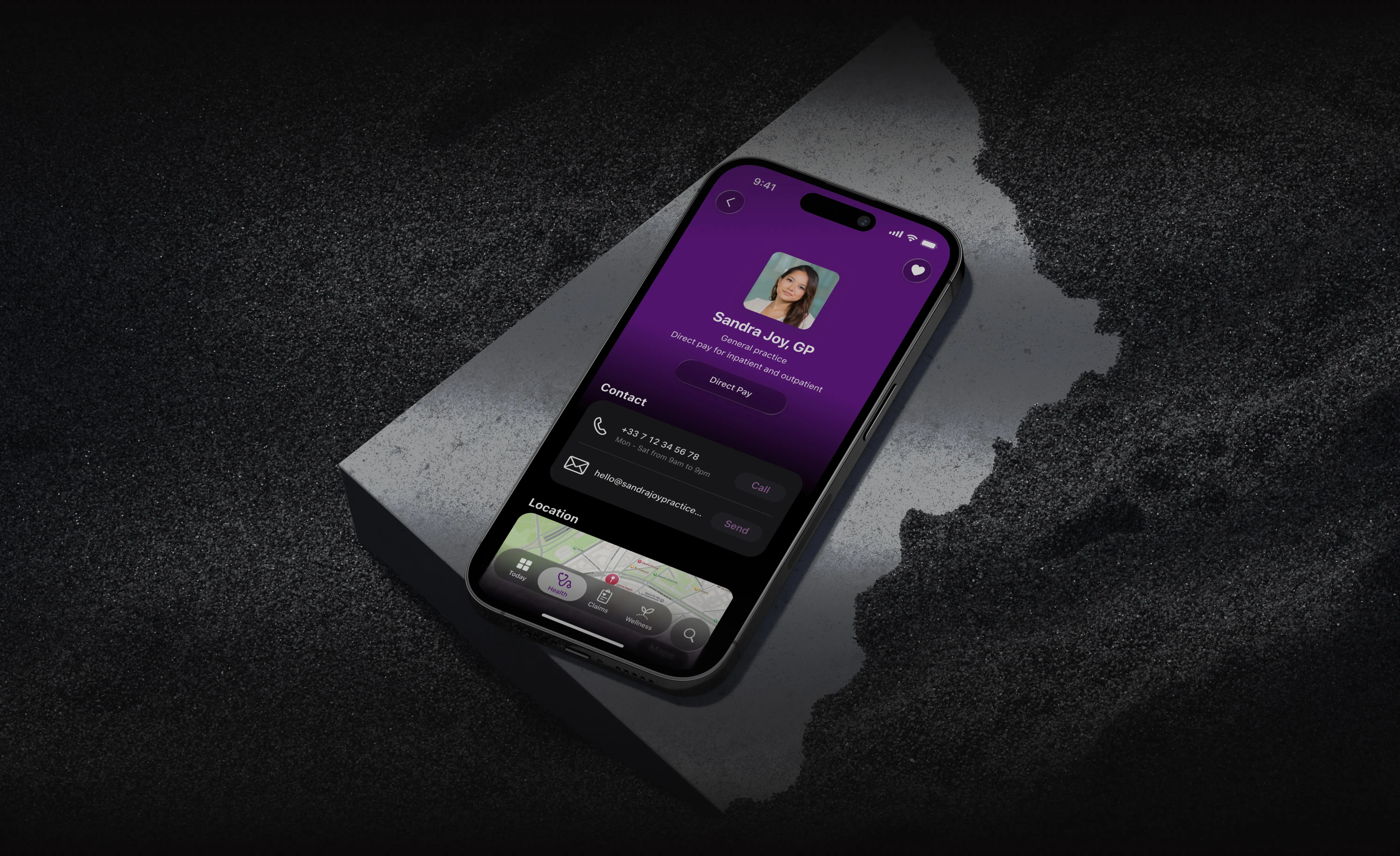 Phone resting on a concrete slab, showing the provider profile screen for Sandra Joy, GP